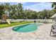 Relaxing backyard oasis with a kidney-shaped pool at 1729 Oakwood Estates Dr, Plant City, FL 33563