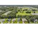 Aerial view showcasing neighborhood homes and green spaces at 1729 Oakwood Estates Dr, Plant City, FL 33563