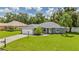 Single-story house with garage and well-maintained lawn at 1729 Oakwood Estates Dr, Plant City, FL 33563