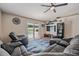 Relaxing living room with sectional sofa, sliding glass doors, and pool view at 1729 Oakwood Estates Dr, Plant City, FL 33563