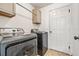 Laundry room with washer, dryer, and cabinets at 1729 Oakwood Estates Dr, Plant City, FL 33563
