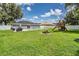 Large backyard with pool, patio, firepit, and playground at 1729 Oakwood Estates Dr, Plant City, FL 33563