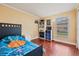 Bedroom with a single bed and built-in shelving at 1729 Oakwood Estates Dr, Plant City, FL 33563