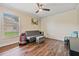 Bedroom with sofa, gaming chair, and toy storage at 1729 Oakwood Estates Dr, Plant City, FL 33563