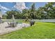 Spacious backyard oasis with pool, patio furniture, and play area at 1729 Oakwood Estates Dr, Plant City, FL 33563