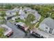 Aerial view of condo community with ample parking and lush surroundings at 12125 Spartan Way # 201, Hudson, FL 34667
