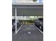 Covered parking area with parking spots and cars at 12125 Spartan Way # 201, Hudson, FL 34667