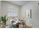 Bright dining area with a round table and four chairs, perfect for small meals at 12125 Spartan Way # 201, Hudson, FL 34667