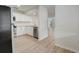 Modern kitchen with stainless steel appliances and white cabinets at 12125 Spartan Way # 201, Hudson, FL 34667