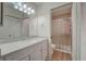Updated bathroom with new vanity and walk-in shower at 12125 Spartan Way # 201, Hudson, FL 34667