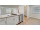 Modern kitchen with stainless steel appliances and white cabinets at 12125 Spartan Way # 201, Hudson, FL 34667