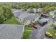 Aerial perspective of condo complex, highlighting building design and landscaping at 12125 Spartan Way # 201, Hudson, FL 34667