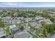 Wide aerial view of the community, highlighting buildings and landscape at 12125 Spartan Way # 201, Hudson, FL 34667