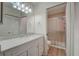 Clean bathroom with a large vanity and a walk-in shower at 12125 Spartan Way # 201, Hudson, FL 34667