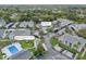 Community overview showing building, pool, and parking at 12125 Spartan Way # 201, Hudson, FL 34667