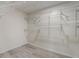 Large walk-in closet with ample shelving and hanging space at 12125 Spartan Way # 201, Hudson, FL 34667