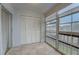 Screened lanai with tile flooring and access to outdoors at 12125 Spartan Way # 201, Hudson, FL 34667
