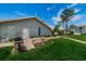 Community picnic area with grill, table, and grassy area at 12125 Spartan Way # 201, Hudson, FL 34667