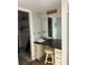 Built-in vanity and stool in a small dressing area with access to the closet at 5157 Silent Loop # 302, New Port Richey, FL 34652