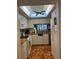White kitchen featuring a skylight, appliances, and countertops at 5157 Silent Loop # 302, New Port Richey, FL 34652