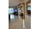 Well-lit living room with waterfront view, adjacent to the dining room at 5157 Silent Loop # 302, New Port Richey, FL 34652