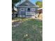 Gray house with white porch and small yard at 2907 N 17Th St, Tampa, FL 33605