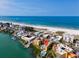 Aerial view of waterfront condo community near beach at 10301 Gulf Blvd # 402, Treasure Island, FL 33706