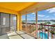 Balcony with sliding door access and water views at 10301 Gulf Blvd # 402, Treasure Island, FL 33706