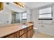 Clean bathroom with wood vanity, toilet, and shower at 10301 Gulf Blvd # 402, Treasure Island, FL 33706