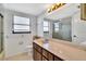 Bathroom with wood vanity and shower/tub combo at 10301 Gulf Blvd # 402, Treasure Island, FL 33706