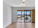 Living room with hardwood floors and sliding doors to balcony at 10301 Gulf Blvd # 402, Treasure Island, FL 33706