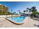 Resort-style pool with plenty of lounge chairs at 10301 Gulf Blvd # 402, Treasure Island, FL 33706