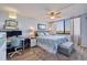 Bright bedroom with a large window, ceiling fan, and a desk area for working from home at 6219 Palma Del Mar S Blvd # 602, St Petersburg, FL 33715