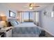 Cozy bedroom with a large window offering stunning city views and a comfortable bed at 6219 Palma Del Mar S Blvd # 602, St Petersburg, FL 33715