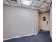 Condo hallway with gray walls, unit number 602, welcome decor, and blue carpet at 6219 Palma Del Mar S Blvd # 602, St Petersburg, FL 33715