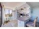 Bright kitchen with stainless steel appliances, breakfast bar, and scenic water views at 6219 Palma Del Mar S Blvd # 602, St Petersburg, FL 33715