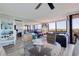 Bright living area with a modern dining table set, comfortable seating, and sliding glass doors to a balcony at 6219 Palma Del Mar S Blvd # 602, St Petersburg, FL 33715