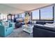 Coastal-themed living room with comfortable seating, scenic views, and a mirrored wall at 6219 Palma Del Mar S Blvd # 602, St Petersburg, FL 33715