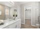 Modern bathroom with a white vanity and walk-in shower at 47A Bayview S Ct, St Petersburg, FL 33711