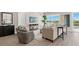Comfortable living room featuring a neutral color palette and water views at 47A Bayview S Ct, St Petersburg, FL 33711