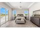 Main bedroom with water views, large windows, and plush bedding at 47A Bayview S Ct, St Petersburg, FL 33711