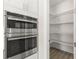 Walk-in pantry with ample shelving for storage at 47A Bayview S Ct, St Petersburg, FL 33711