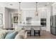 Modern kitchen with white cabinets, quartz countertops, and island at 47A Bayview S Ct, St Petersburg, FL 33711