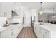 Bright kitchen featuring white cabinetry, gas cooktop, and stainless steel appliances at 47A Bayview S Ct, St Petersburg, FL 33711
