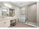 Spa-like bathroom with soaking tub, walk-in shower, and double vanity at 47A Bayview S Ct, St Petersburg, FL 33711