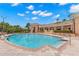 Inviting community pool with lounge chairs and a clubhouse in the background at 47A Bayview S Ct, St Petersburg, FL 33711