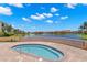Relaxing community spa with lake view and resort-style landscaping at 47A Bayview S Ct, St Petersburg, FL 33711