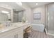 Elegant bathroom boasting a double vanity, soaking tub, and walk-in shower at 47A Bayview S Ct, St Petersburg, FL 33711