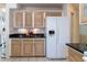 Kitchen with granite countertops, light wood cabinets, and stainless steel appliances at 1691 Polo Club Dr, Tarpon Springs, FL 34689