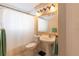 Bathroom with pedestal sink, toilet and bathtub at 1691 Polo Club Dr, Tarpon Springs, FL 34689